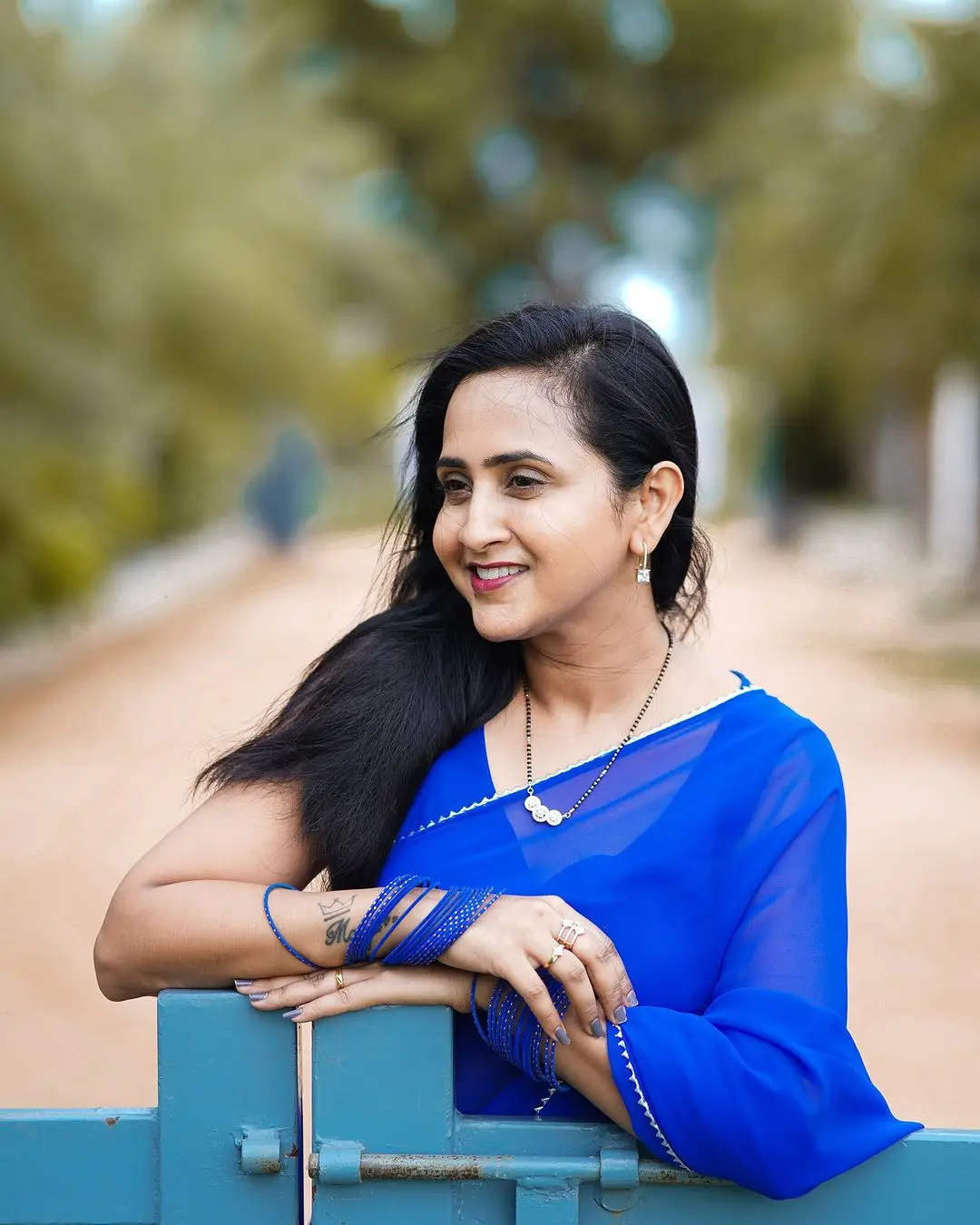 etv actress lasya manjunath in blue saree sleeveless blouse